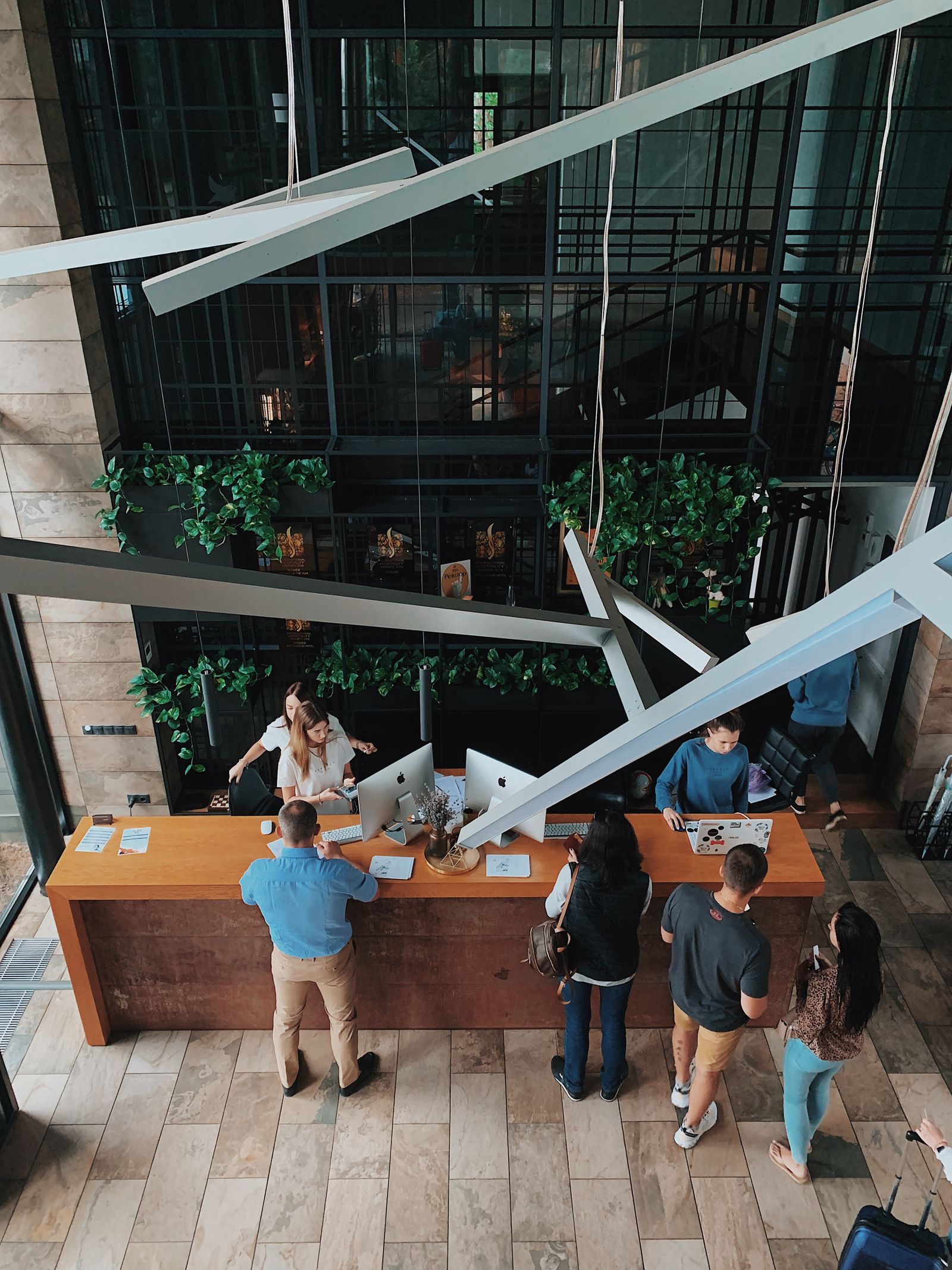 High angle view of guests at a hotel reception desk
