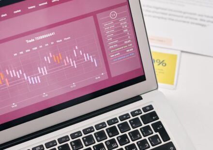 Laptop showing financial graphs