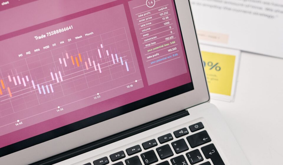 Laptop showing financial graphs